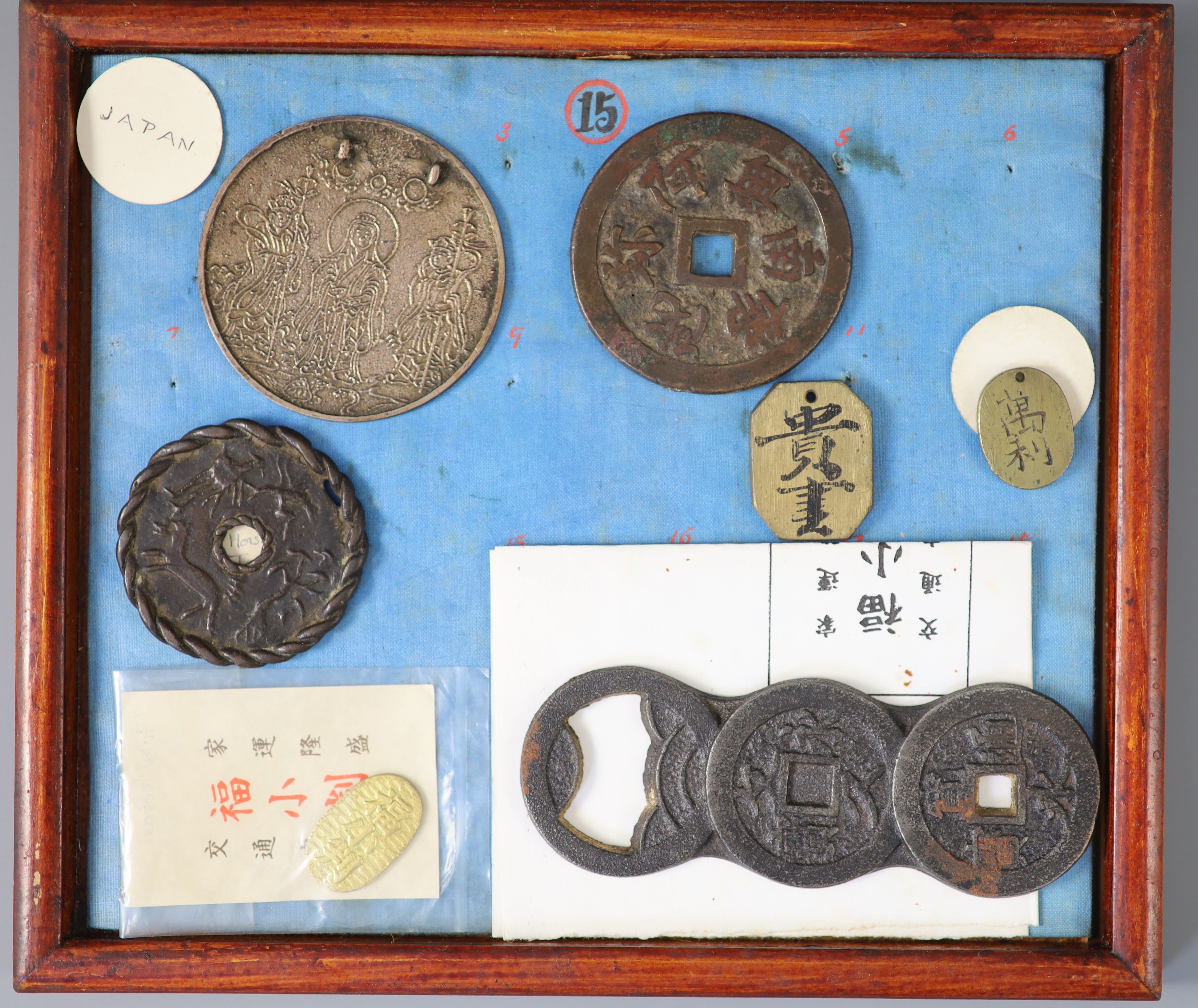 A group of 40 Japanese bronze and metal amulets or charms, 19th/20th century,